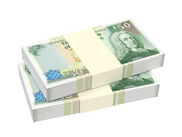 istock Stack of Scotland pound bills isolated on white background. 518176312