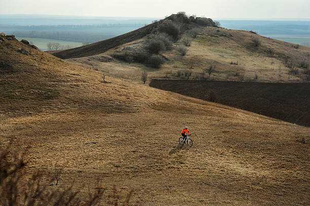 istock Man cyclist with backpack riding the bicycle 518176470
