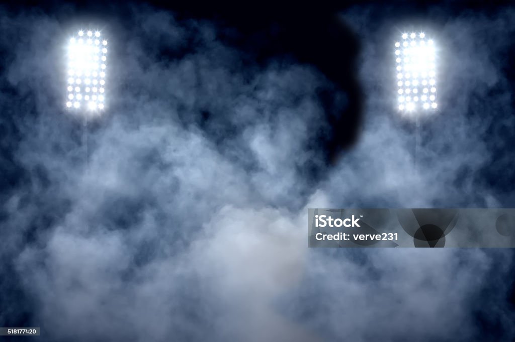 stadium lights and smoke Floodlight Stock Photo