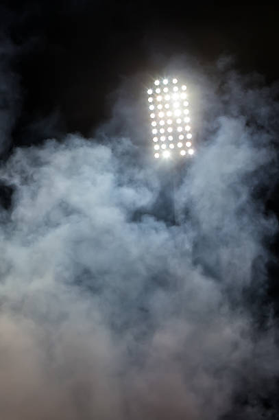 istock stadium lights and smoke 518177756