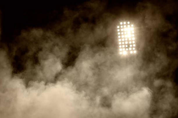 istock stadium lights and smoke 518177910
