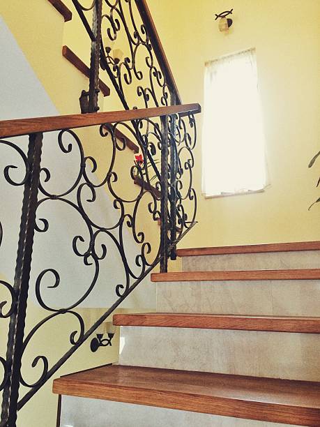 istock Marble staircase with black wrought iron railing 518180068