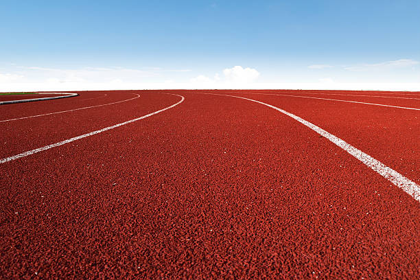 istock Athletics Stadium Running track curve and blue sky 518180126