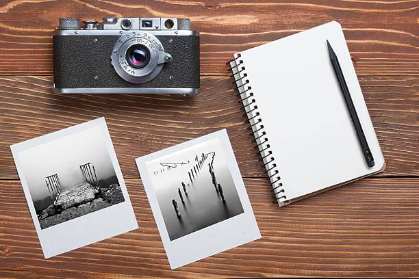 istock Travel, vacation concept. Camera, notepad, pen and photography on office 518181046