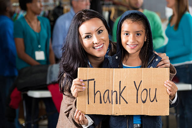 istock Mother and daughter at coat drive 518181282