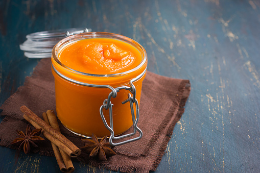spicy pumpkin pudding in glass jar, selective focus