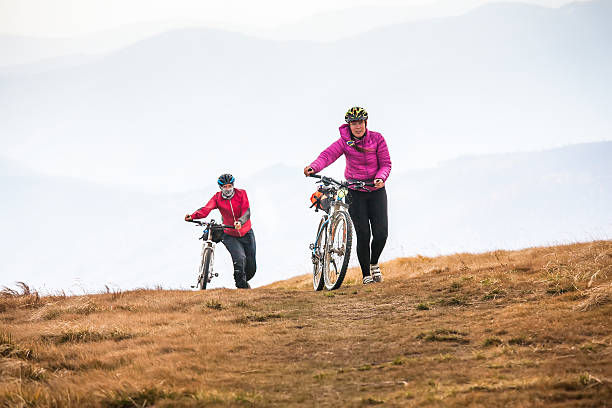istock Biker riding in autumn mountains 518184822