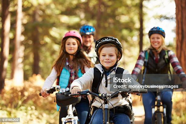 Family Mountain Biking On Forest Trail Front View Closeup Stock Photo - Download Image Now