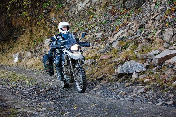 istock Motorbiker travelling in autumn mountains 518196732