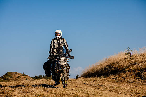 istock Motorbiker travelling in autumn mountains 518196894