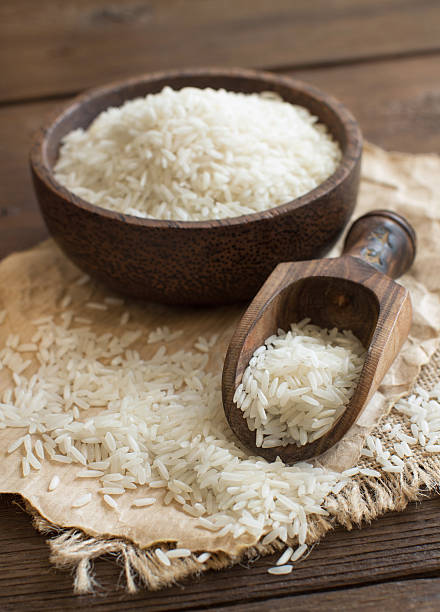istock Pile of Basmati rice in a bowl with a spoon 518197312