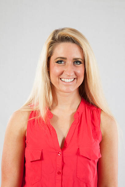 istock Blond woman smiling at the camera 518197459