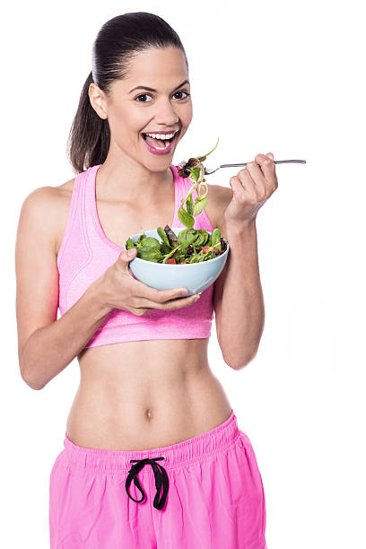 istock Pretty fit woman having salad 518197496