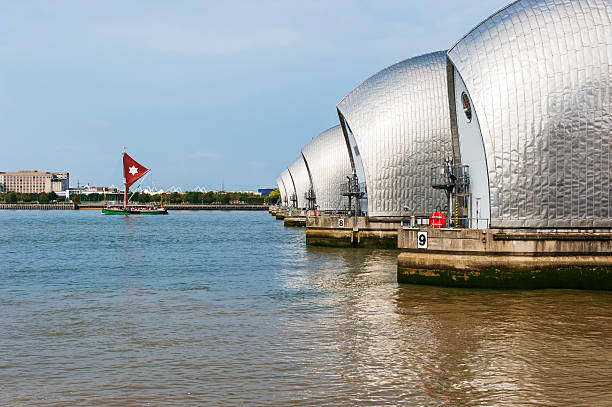 istock Sailing Barge and the Thames Barrier 518197919