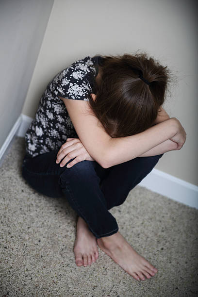 istock Girl in Corner 518198075