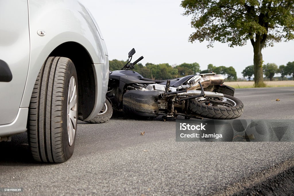 Motorbike Accident Motorbike Accident on the road with a car Motorcycle Stock Photo