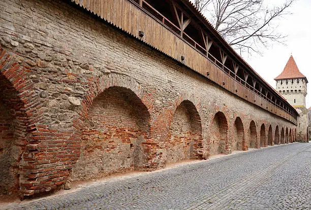 Medieval wall of an ancient stronghold, made of bricks