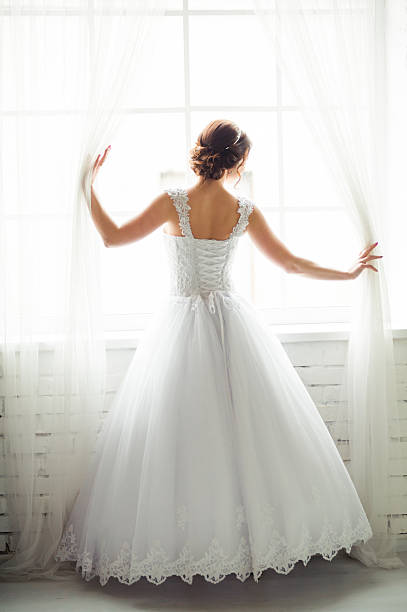 istock Beautiful bride before wedding ceremony in church 518199546