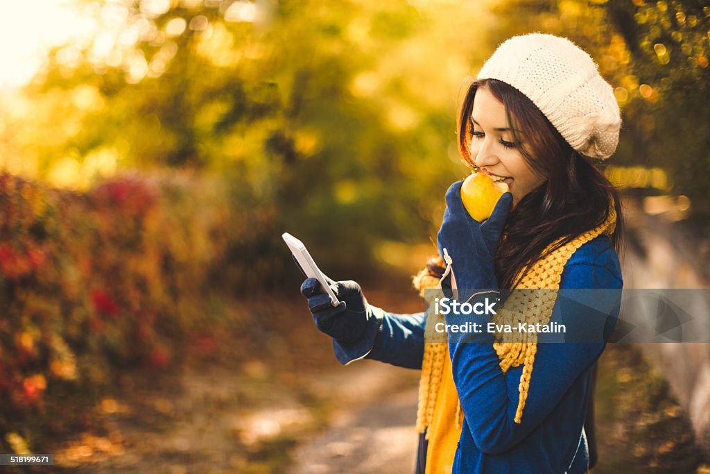 Autumn portrait Autumn portrait of a beautiful young woman Eating Stock Photo