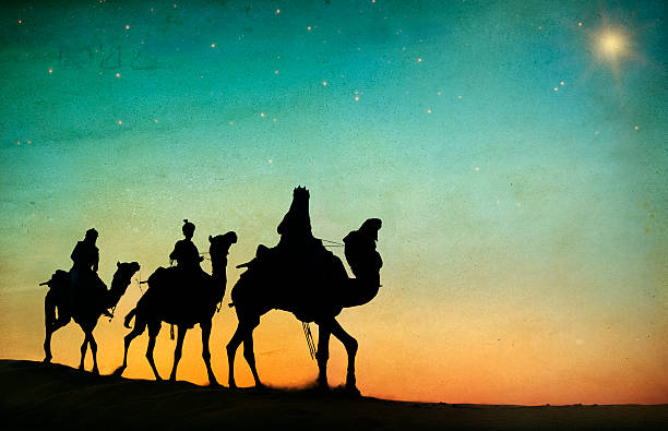 istock Group of People Riding Camel Isolated on Background 518200303
