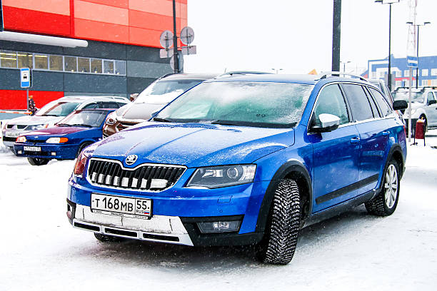Skoda Octavia Scout Novyy Urengoy, Russia - February 21, 2016: Motor car Skoda Octavia Scout is parked in the city street. covered wagon horse cart snow winter stock pictures, royalty-free photos & images