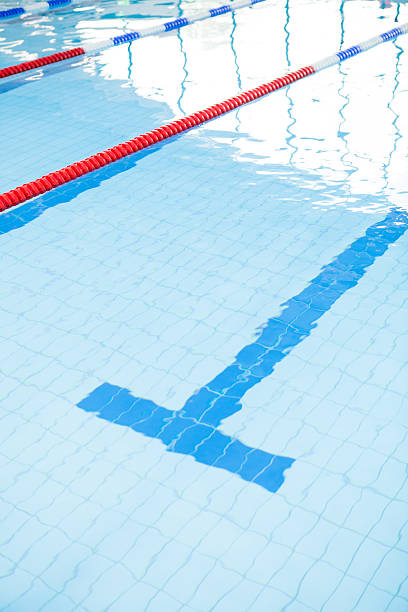 Swimming pool lanes Swimming pool lanes with bottom lane line and ropes swimming pool lane ropes stock pictures, royalty-free photos & images