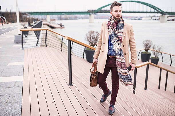 istock Young handsome man standing on a wharf 518200816