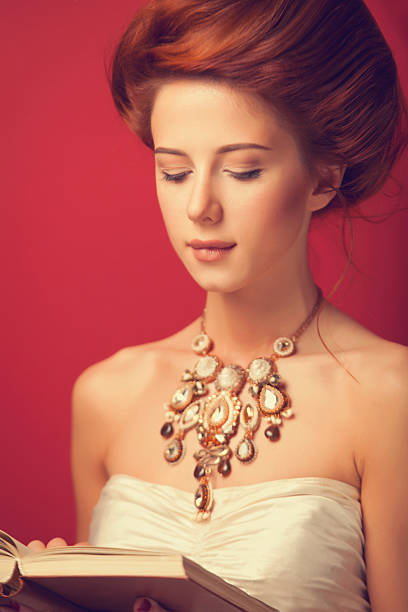istock edwardian women with necklace and book 518200913