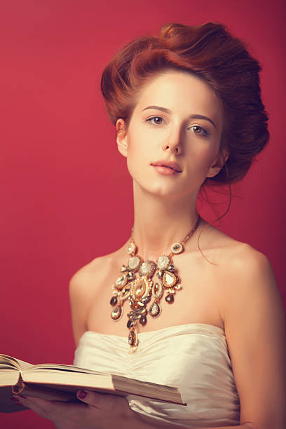 istock edwardian women with necklace and book 518200917