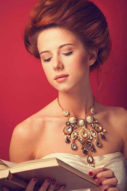 istock edwardian women with necklace and book 518200931