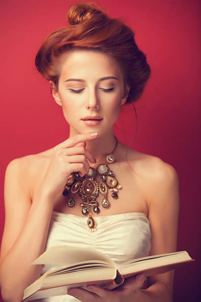 istock edwardian women with necklace and book 518200943