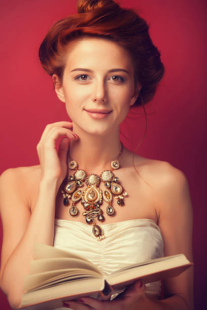 istock edwardian women with necklace and book 518200953
