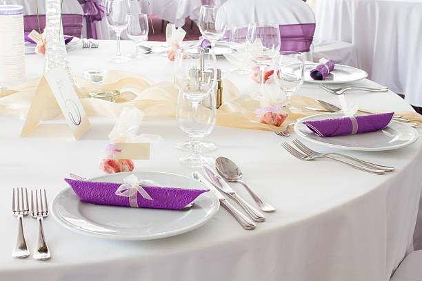 istock luxury place setting, purple napkin on plate 518202411