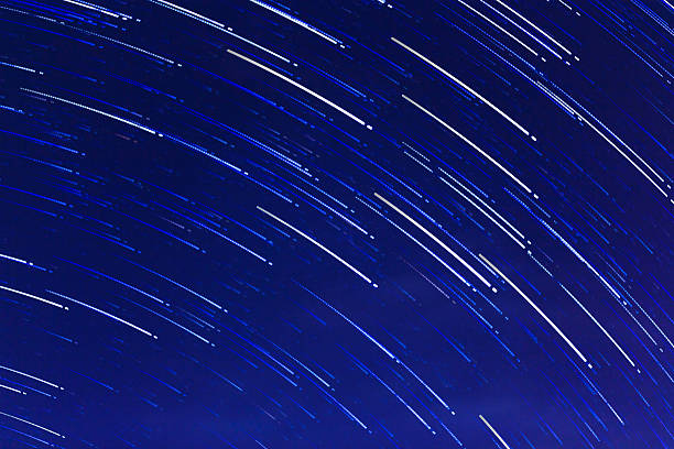 istock abstract long exposure of star trails background 518203867