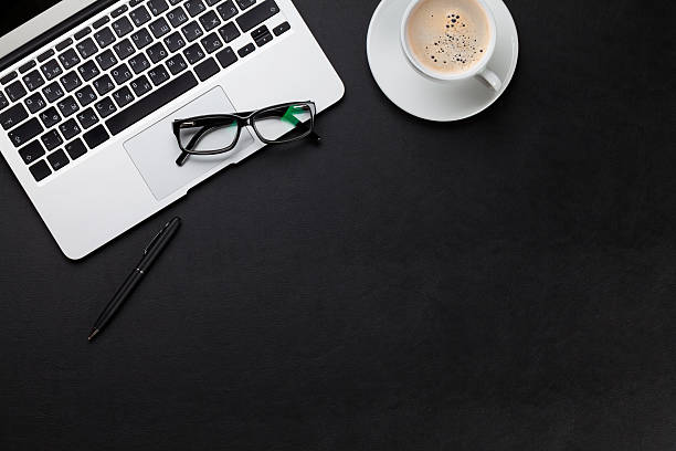 istock Office desk with laptop and coffee cup 518204568