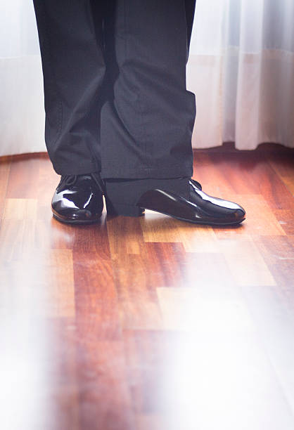 A close-up image of a man's samba shoes