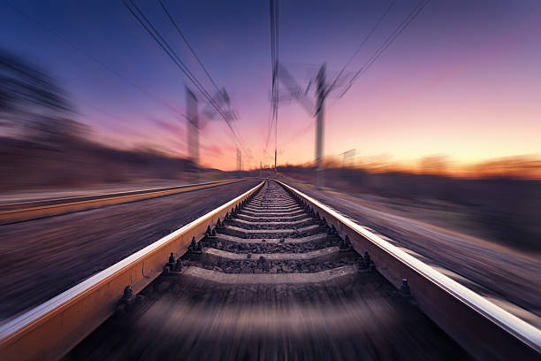 istock Railway station at colorful sunset with motion blur effect. Railroad 518206446