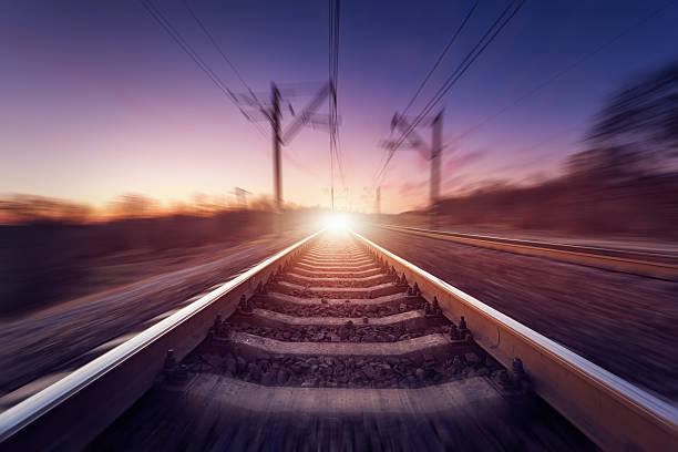 istock Railway station at colorful sunset with motion blur effect. Railroad 518206474