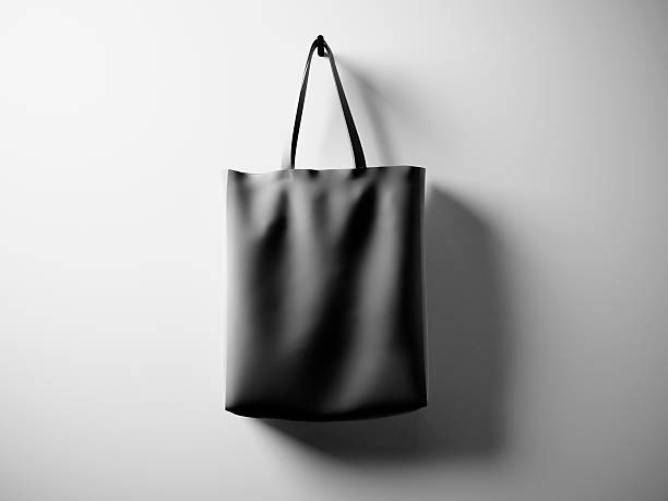 istock Photo black rubberized material bag hanging in center. Empty white 518206656