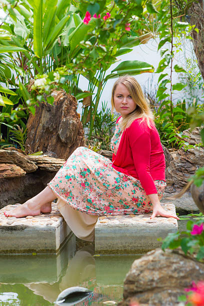 istock Young woman in summer park 518206794