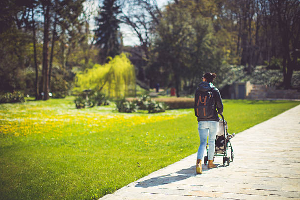istock Beautiful women walking with her son 518210350