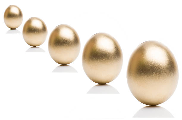 istock Golden eggs from  isolated on a white background. 518219644