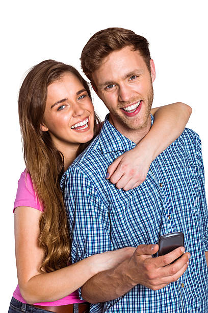 istock Cheerful young couple with mobile phone 518220571