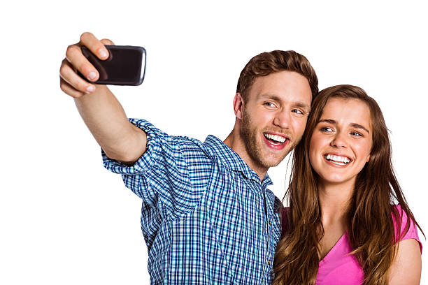 istock Couple taking selfie with smart phone 518220585