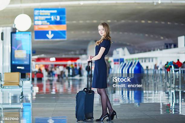 Young Female Traveler In International Airport Stock Photo - Download Image Now - Adult, Airline Check-In Attendant, Airport