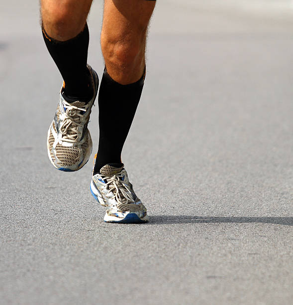 istock runner with sneakers during the Marathon 518221613
