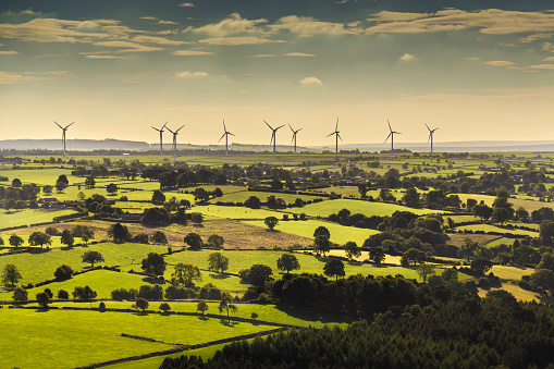 Wind turbines and farmland near Leeds, West Yorkshire. Aerial view from a helicopter 