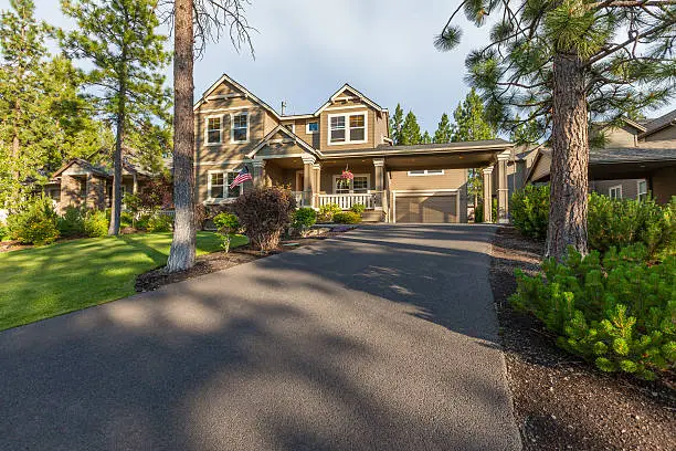 Front elevation and driveway of a beautiful home.