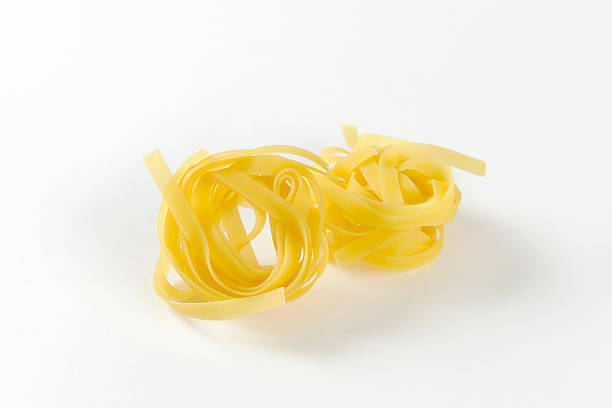 istock Nests of dry pasta tagliatelle 518223010