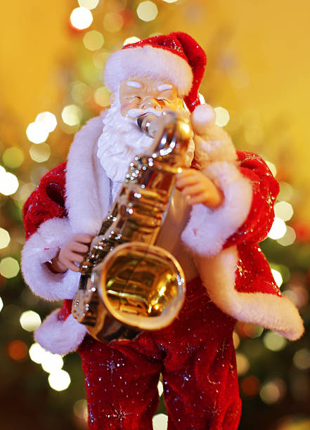 istock Santa Claus figurine playing music on saxophone 518223378